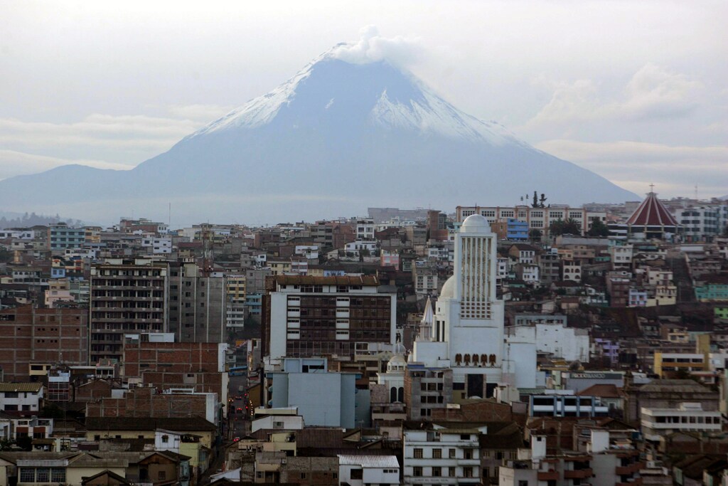 Tungurahua volcano is seen from Ambato city August 28, 2006, eleven days after an eruption which forced thousands from their homes. Tungurahua, which means "throat of fire" in native Quichua language and is located 80 miles (130 km) south of the capital Quito, has tossed out ash and rocks since July. REUTERS/Stringer (EQUADOR) - RTR1GRZ2