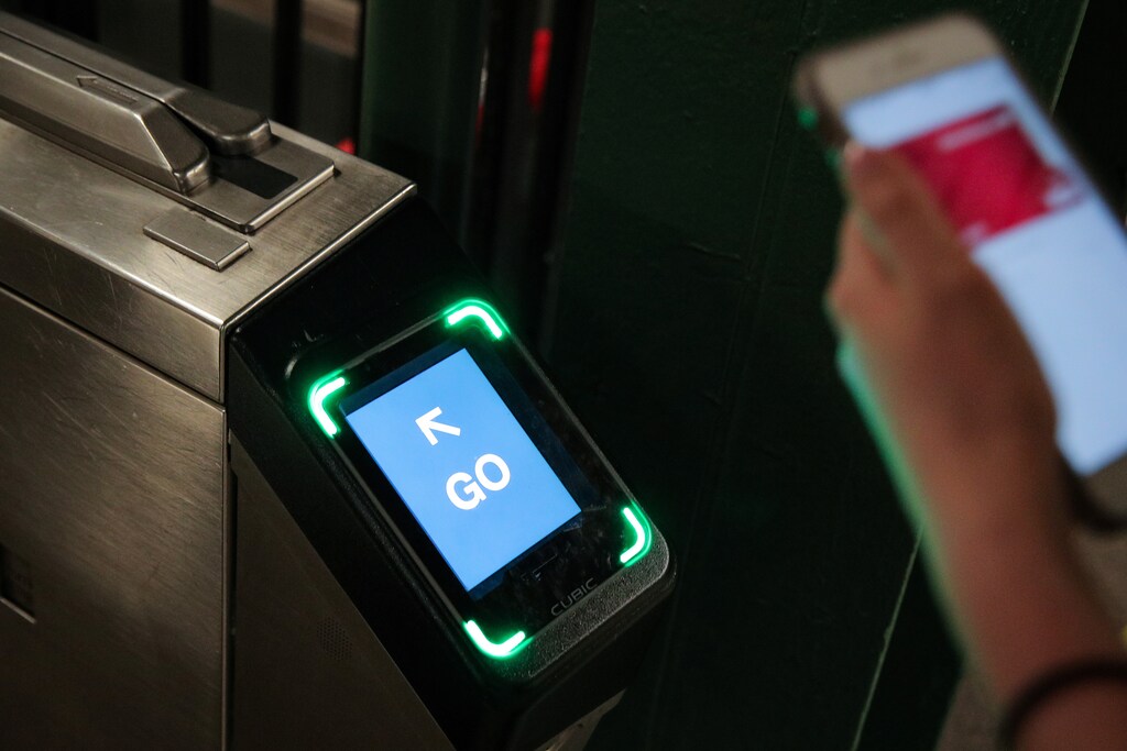 A customer uses a phone to pay for a New York City subway ride on the first day of operation of the OMNY (One Metro NY) contactless payment system in New York, U.S., May 31, 2019