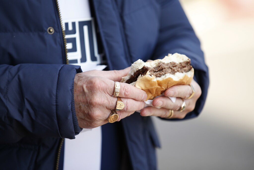 Britain Football Soccer - West Bromwich Albion v Tottenham Hotspur - Premier League - The Hawthorns - 15/10/16General view of a fan eating food before the gameAction Images via Reuters / Andrew BoyersLivepicEDITORIAL USE ONLY. No use with unauthorized audio, video, data, fixture lists, club/league logos or "live" services. Online in-match use limited to 45 images, no video emulation. No use in betting, games or single club/league/player publications. Please contact your account representative for further details. - RTX2OXX9