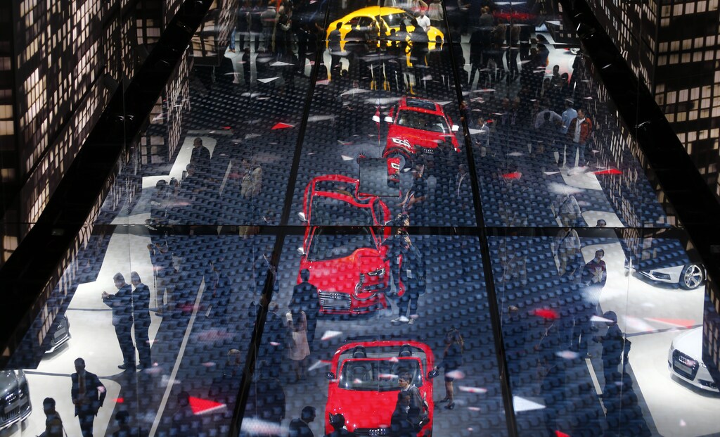The stand of German car manufacturer Audi is reflected in the ceiling during a media preview day at the Frankfurt Motor Show (IAA) September 11, 2013. The world's biggest auto show is open to the public September 14 -22. REUTERS/Kai Pfaffenbach (GERMANY - Tags: TRANSPORT BUSINESS) - BM2E99B10PQ01