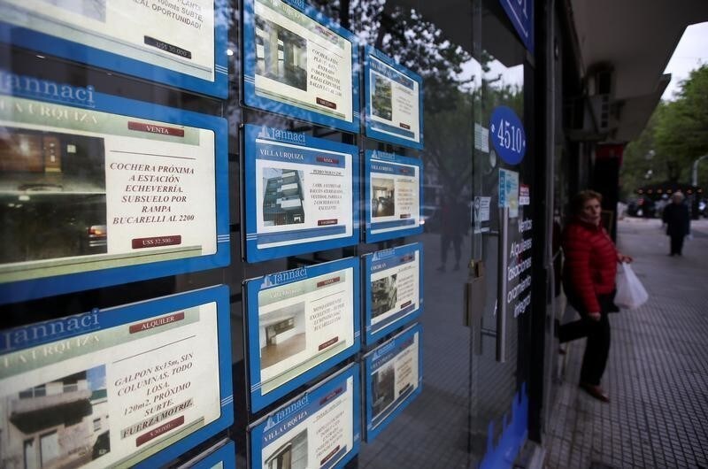A board advertising apartments for sale or rent is displayed at a real estate agency in Buenos Aires, Argentina October 15, 2019. Picture taken October 15, 2019. REUTERS/Agustin Marcarian - RC17A08FFD80