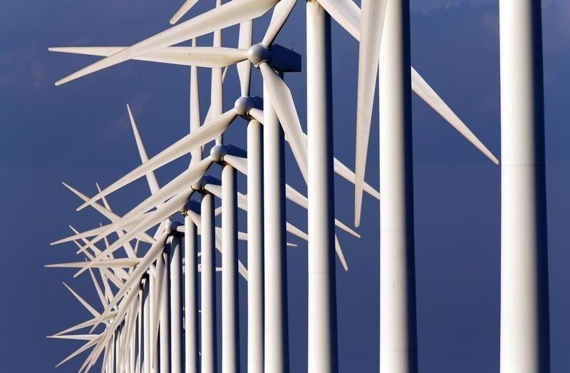 Power-generating windmill turbines are seen near Port Saint Louis du Rhone, near Marseille, May 7, 2014. The French government has awarded a tender to build and run two offshore windfarms to a consortium led by French gas and power group GDF Suez, French Energy Minister Segolene Royal said on Wednesday. REUTERS/Jean-Paul Pelissier (FRANCE - Tags: ENERGY SCIENCE TECHNOLOGY BUSINESS) - RTR3O7ZZ