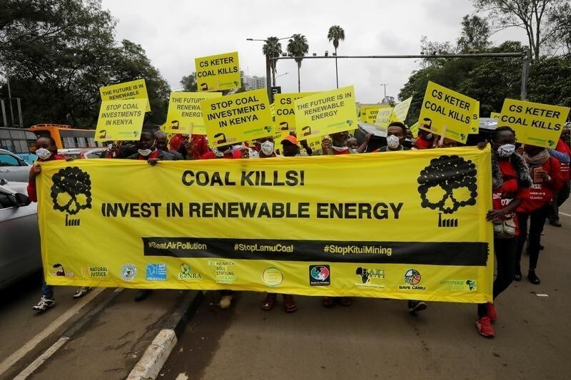 Greenpeace and environmental activists hold banners against the construction of a coal fired electricity plant in Lamu on Kenya's coast, during a protest in Nairobi, Kenya, June 12, 2019. REUTERS/Baz Ratner - RC16B412DE00