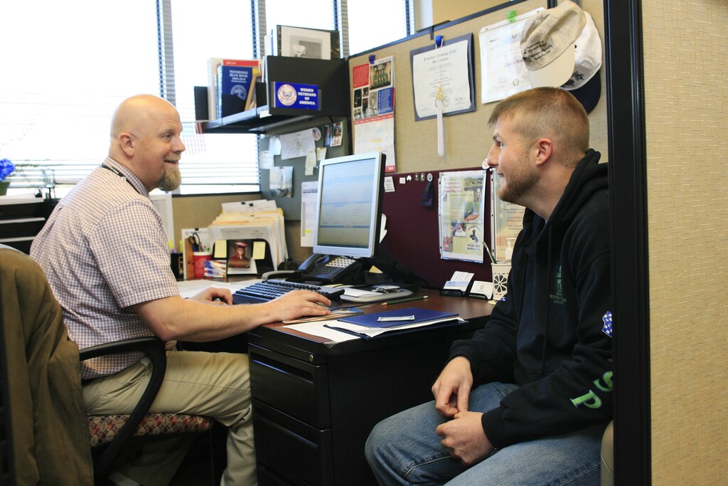 Casey Caldwell screens Chris Harris (R) for a job with Yates Services at the Tennessee Career Center in Murfreesboro, Tennessee, December 10, 2011. The United Auto Workers union is staking its future on the kind of struggle it hasn?t waged since the 1930s: a massive drive to organize hostile factories. This time, the target is foreign car makers,whose workers have rebuffed the union repeatedly. Specifically, Reuters has learned, the union is going after U.S. plants owned by German manufacturers Volkswagen AG and Daimler AG , seen as easier nuts to crack than the Japanese and South Koreans. Photo taken December 10, 2011. To match Special Report USA-AUTOS/SOUTH REUTERS/M. J. Masotti Jr. (UNITED STATES - Tags: BUSINESS EMPLOYMENT TRANSPORT) - GM1E7CT1D4R01