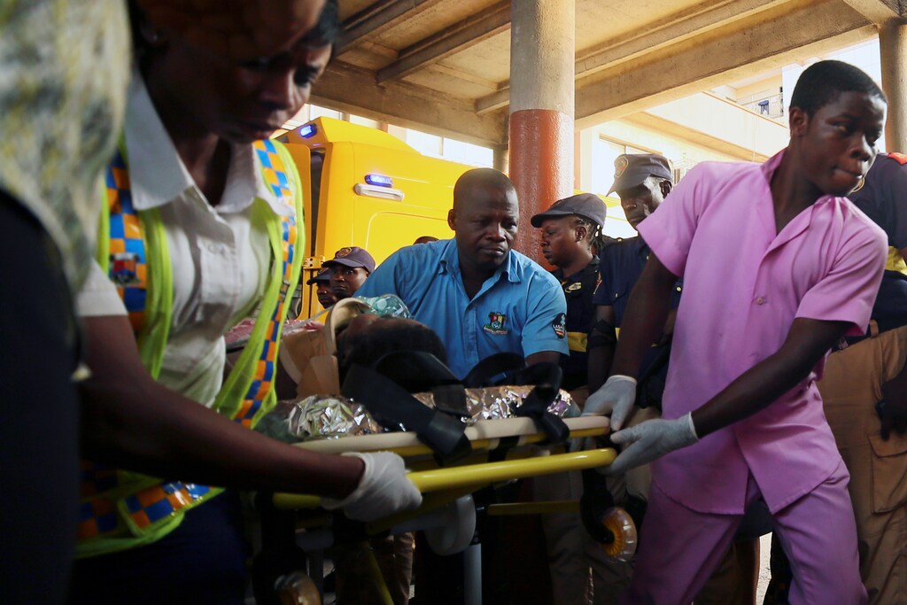 Medics transport an injured person in Lagos, Nigeria.