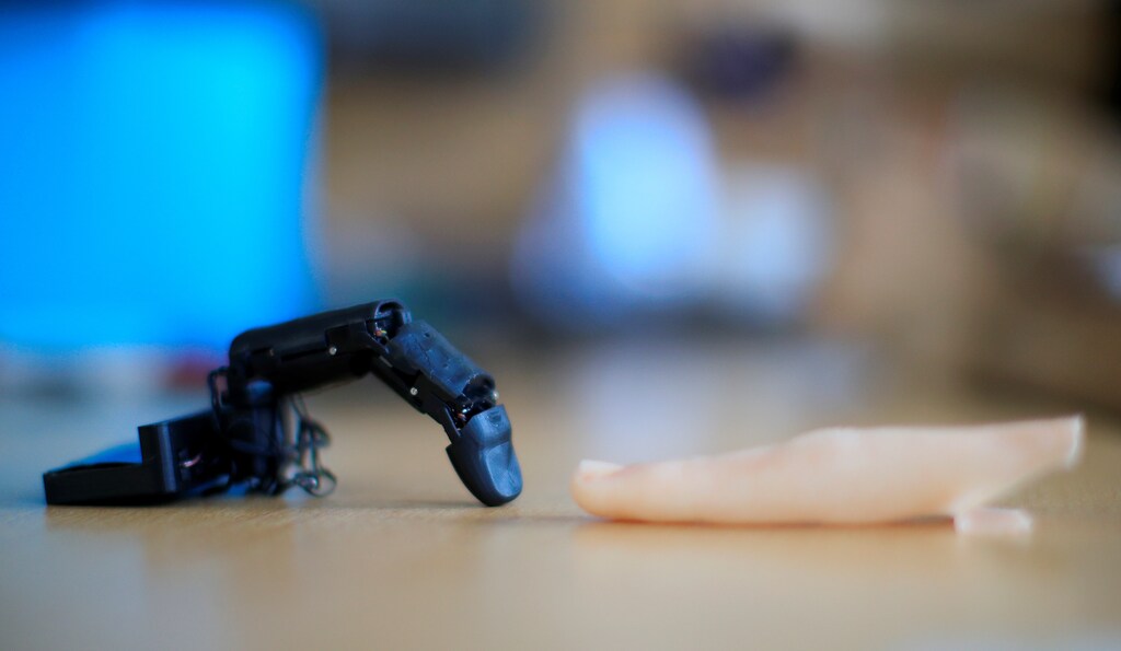 The robot finger 'MobiLimb' that attaches to a mobile phone, invented by Marc Teyssier, a PhD student at Telecom Paris Tech Engineering school, is displayed after an interview with Reuters in Paris, France October 9, 2018. Picture taken on October 9, 2018. REUTERS/Gonzalo Fuentes - RC11132D5060