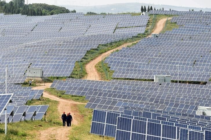 Solar panels are seen at a solar power plant in Pingdingshan, Henan province, China June 7, 2018. Picture taken June 7, 2018. REUTERS/Stringer