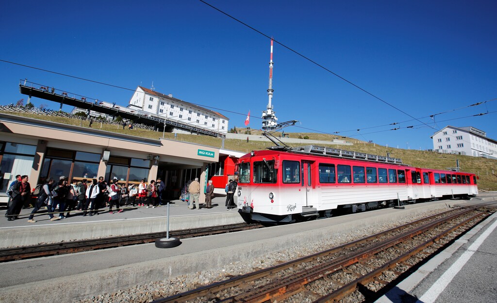 A train arrives during sunny autumn weather at the station near the peak of Mount Rigi, Switzerland October 22, 2018. REUTERS/Arnd Wiegmann - RC1372575B10