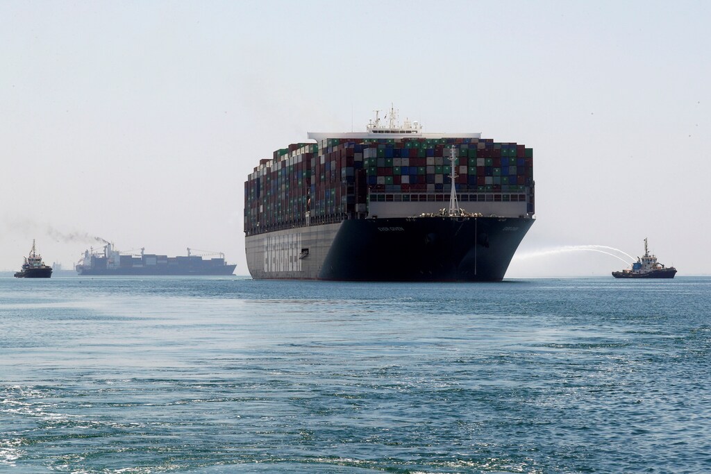 a picture of a large cargo ship full of containers representing supply chains