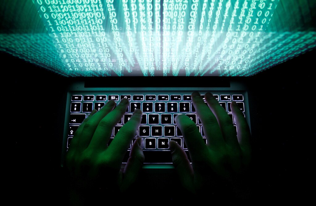 A man types on a computer keyboard in this illustration picture February 28, 2013. REUTERS/Kacper Pempel/Illustration/File Photo - RTSS8DM