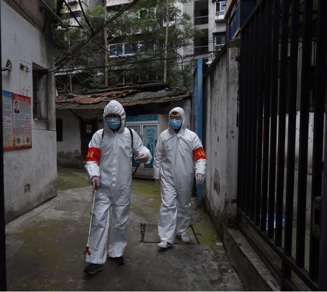 Community workers in protective suits disinfect a residential compound in Wuhan, the epicentre of the novel coronavirus outbreak, Hubei province, China March 6, 2020.