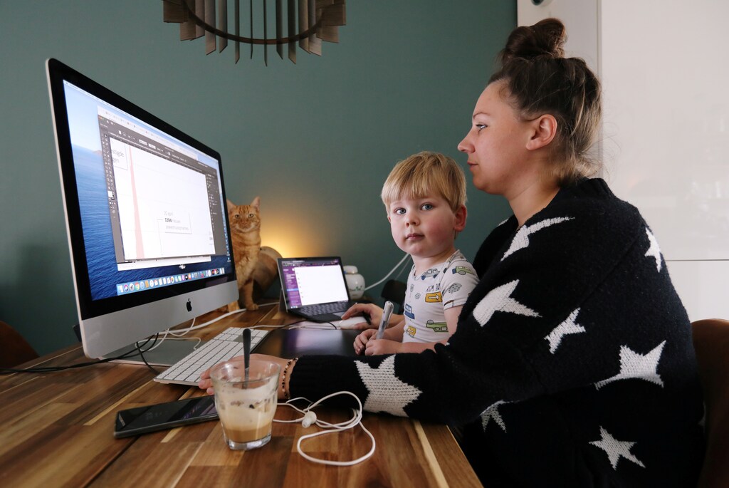 A woman works in a house while workers are forced to work from home and demand payback for extra home office costs during the coronavirus disease (COVID-19) outbreak in Sassenheim, Netherlands October 2, 2020. Picture taken October 2, 2020. REUTERS/Eva Plevier - RC2HDJ99NUAC