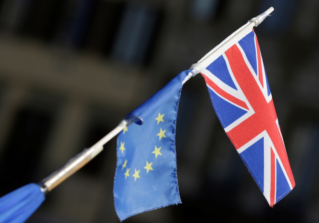 An umbrella with EU and British flags attached to it is held ahead of a speech by Britain's Prime Minister Theresa May in Florence, Italy September 22, 2017. REUTERS/Max Rossi - RC1A4AB5FC90