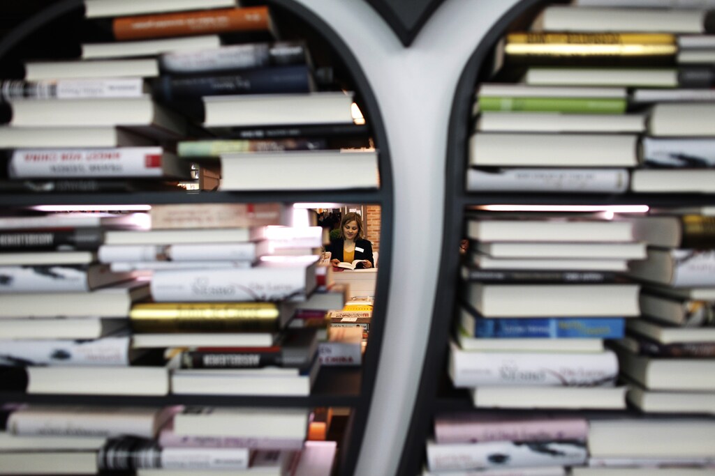 A woman reads a book at the book fair in Frankfurt October 12 2011. The book fair runs until October 16 with its focal theme on the literature of Iceland. REUTERS/Alex Domanski (GERMANYSOCIETY ENTERTAINMENT - Tags: SOCIETY ENTERTAINMENT TPX IMAGES OF THE DAY) - BM2E7AC10T001