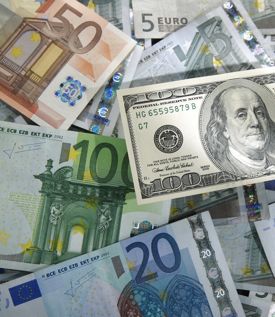 A picture illustration shows a 100 Dollar banknote laying on various denomination euro banknotes, taken in Warsaw, January 13, 2011. The U.S. dollar extended losses against the yen and euro after data showed rising gasoline prices had put U.S. consumers in a gloomy mood in early January. The euro, which hit a one-month high above $1.34 overnight before fading, moved back to $1.3396 after the data. Picture taken January 13. REUTERS/Kacper Pempel (POLAND - Tags: BUSINESS) - BM2E71E1CM601