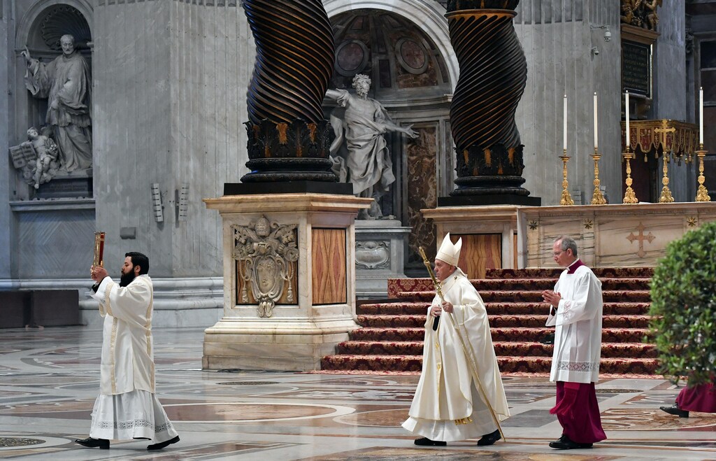 Pope Francis arrives to hold a Mass on Holy Thursday at St. Peter's Basilica with no public participation due to the outbreak of the coronavirus disease (COVID-19) at the Vatican, April 9, 2020. Alessandro Di Meo/Pool via REUTERS - RC241G94OBBU