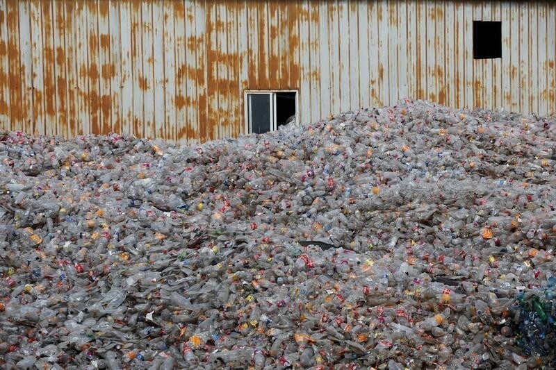 Plastic bottles are stocked to be recycled at the Weeco plastic recycling factory at the Athi River industrial zone near Nairobi, Kenya, May 15, 2019. Picture taken May 15, 2019. REUTERS/Baz Ratner - RC1CF1A1AF60