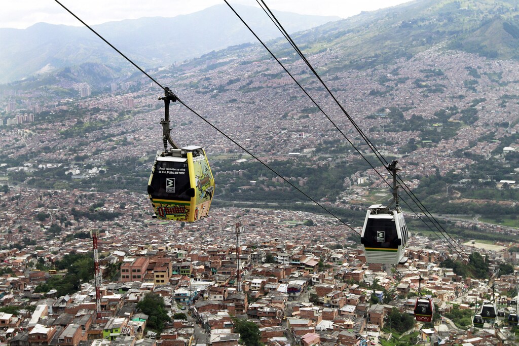 Cable cars pass above the town of Medellin March 1, 2013. The city was designated on Friday "Innovative City of the Year" by Citi, the Wall Street Journal and the Urban Land Institute.