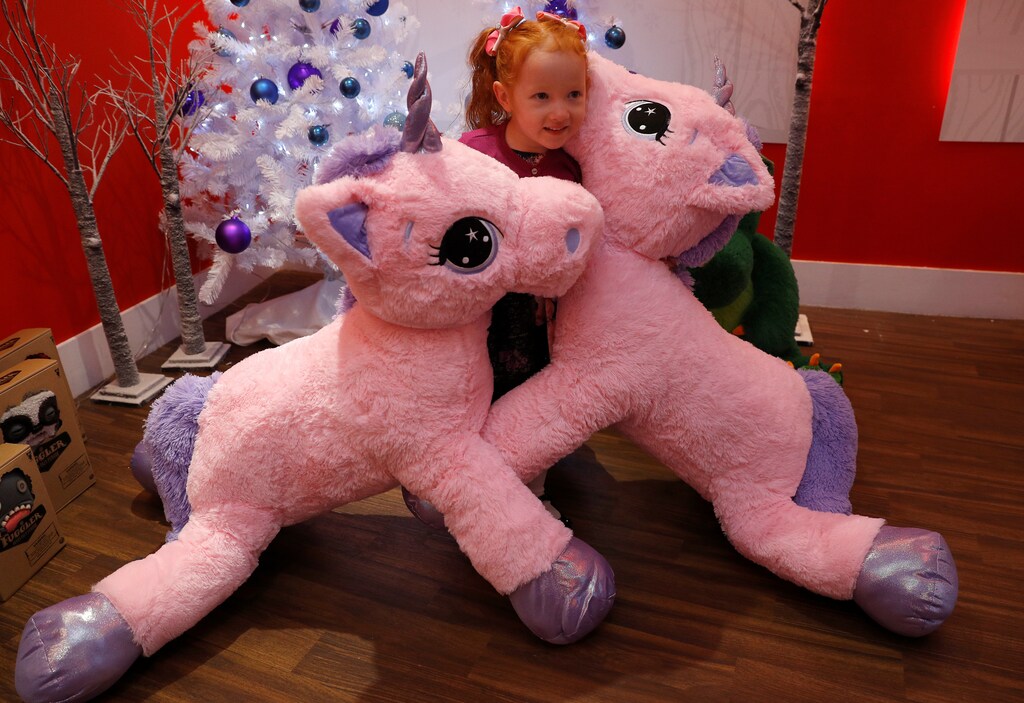 Aston Robertson-Jeyes, aged 3, plays with Unice Unicorn, at the launch of Hamleys top Christmas toys launch in London, Britain, September 26, 2018. REUTERS/Peter Nicholls - RC1A59E60A80