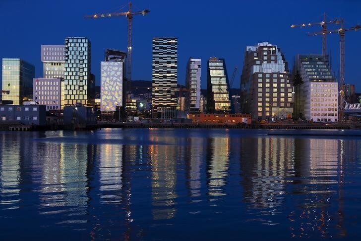 The sunset is reflected off the buildings of The Barcode Project in Oslo November 18, 2012. The row of new high-rise buildings are part of a redevelopment project on the former dock and industrial land in central Oslo, due to be completed in 2014. REUTERS/Cornelius Poppe/NTB Scanpix (NORWAY - Tags: BUSINESS CONSTRUCTION) NO COMMERCIAL OR BOOK SALES. NORWAY OUT. NO COMMERCIAL OR EDITORIAL SALES INNORWAY. THIS IMAGE HAS BEEN SUPPLIED BY A THIRD PARTY. IT IS DISTRIBUTED, EXACTLY AS RECEIVED BY REUTERS, AS A SERVICE TO CLIENTS