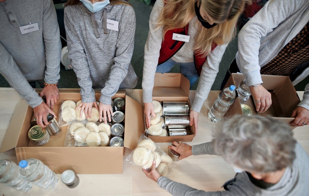 Food bank donations are one way companies can support economic empowerment.