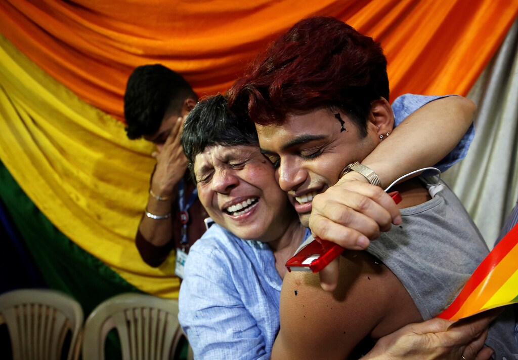 People belonging to the lesbian, gay, bisexual and transgender (LGBT) community celebrate after the Supreme Court's verdict of decriminalizing gay sex and revocation of the Section 377 law, at an NGO in Mumbai, India, September 6, 2018. REUTERS/Francis Mascarenhas - RC1CF1737F80