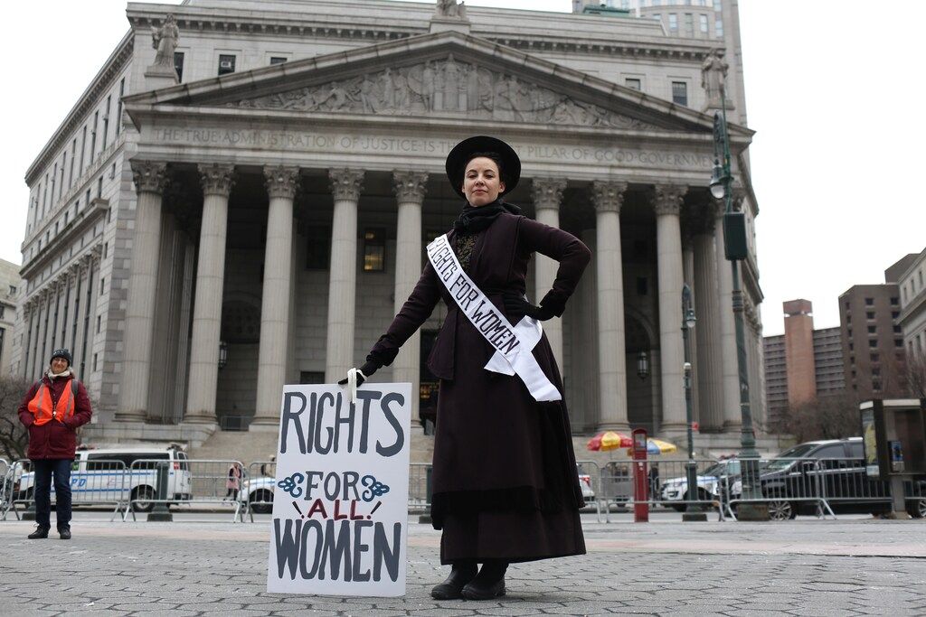 Amy Winn, 44, poses for a portrait representing 100 years of women's suffrage at the Women's Unity Rally, in front of the New York Supreme Court in Manhattan, in New York City, New York, U.S., January 19, 2019. REUTERS/Gabriela Bhaskar - RC1EE615D110