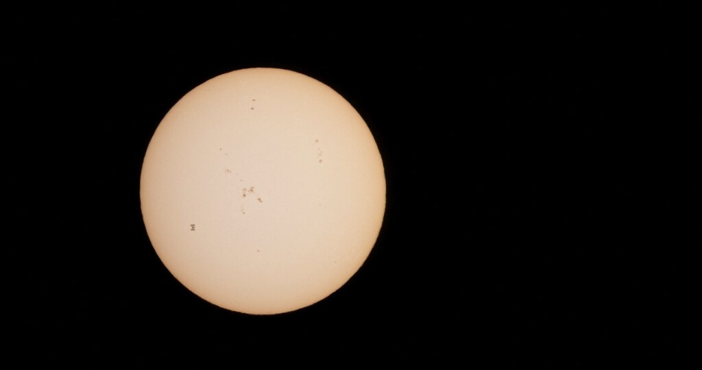 The International Space Station (ISS) is silhouetted as it transits the Sun, as seen from the island of Tenerife, Spain, April 19, 2024.