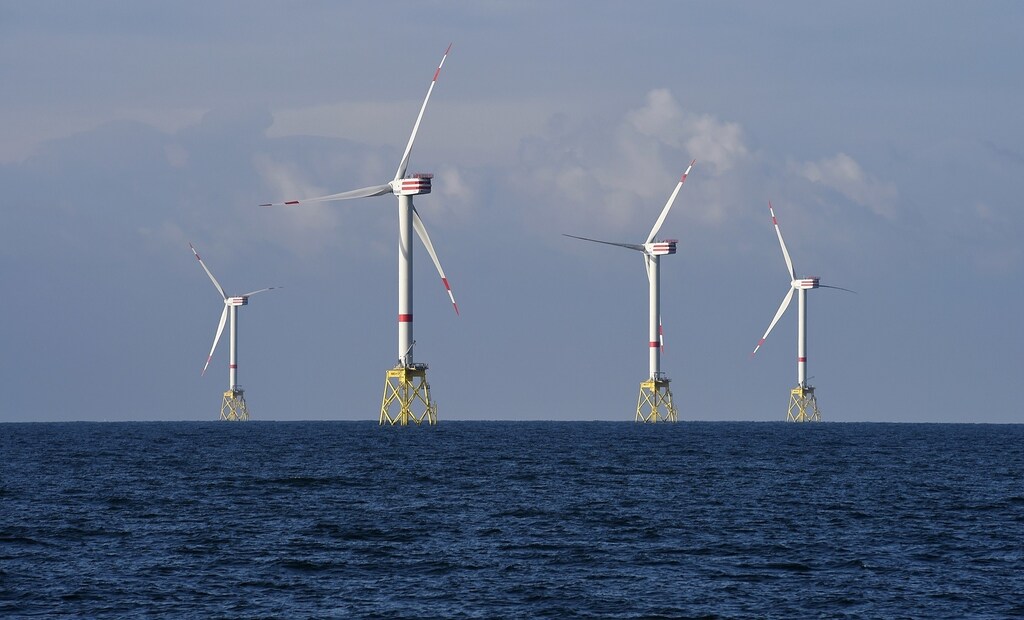 A view shows windmills of several wind farms at the so-called "HelWin-Cluster", located 35 kilometres (22 miles) north of the German island of Heligoland November 5, 2014. As European governments start to curb offshore renewable power subsidies, utilities, wind turbine makers and installers are racing to cut costs to help the industry survive. Britain, Germany and the Netherlands, wary of committing billions of euros when budgets are tight, have announced subsidy cuts in the past 18 months - a blow to the European offshore wind industry which employs nearly 60,000 people. This has led the European Wind Energy Association (EWEA) to slash its forecasts for installed offshore capacity in Europe. However, utilities remain keen to invest in offshore wind - which the EWEA says is the fastest-growing power technology in Europe. To match story RENEWABLES-WINDPOWER/OFFSHORE Picture taken November 5, 2014. REUTERS/Fabian Bimmer (GERMANY - Tags: ENERGY ENVIRONMENT) - RTR4E6FW