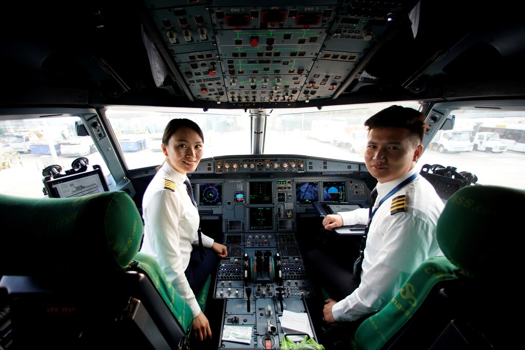 Captain Han Siyuan, 30, poses in the cockpit of Spring Airlines' Airbus A320 before taking off at Hongqiao International Airport in Shanghai, China October 18, 2018. Picture taken October 18, 2018. REUTERS/Aly Song - RC1A0A6AAD90