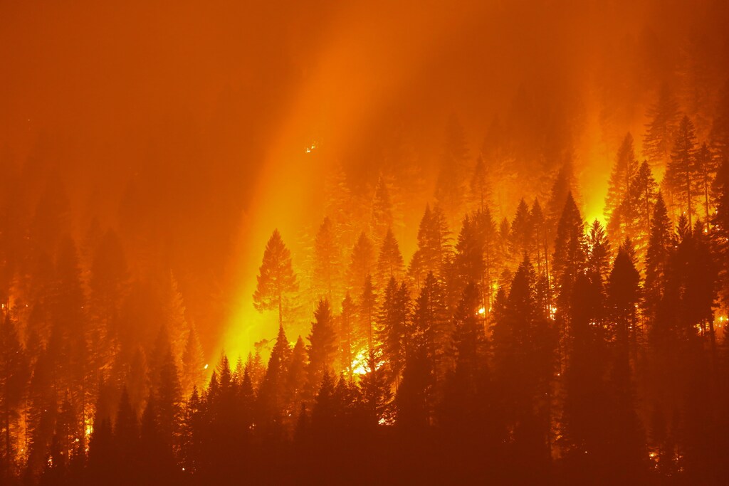 the Dixie Fire, covering over 200,000 acres, burns at night in Taylorsville, California, U.S., July 27, 2021