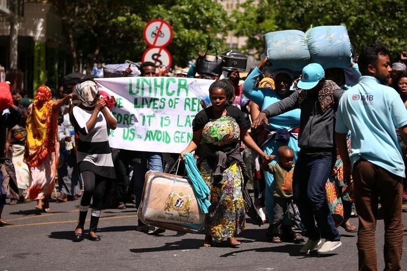Refugees protest against xenophobia as they gather around the United Nations High Commissioner for Refugees (UNHCR) offices, requesting the agency to send them to safer countries, in Cape Town, South Africa, October 18, 2019. REUTERS/Sumaya Hisham - RC189043AFA0
