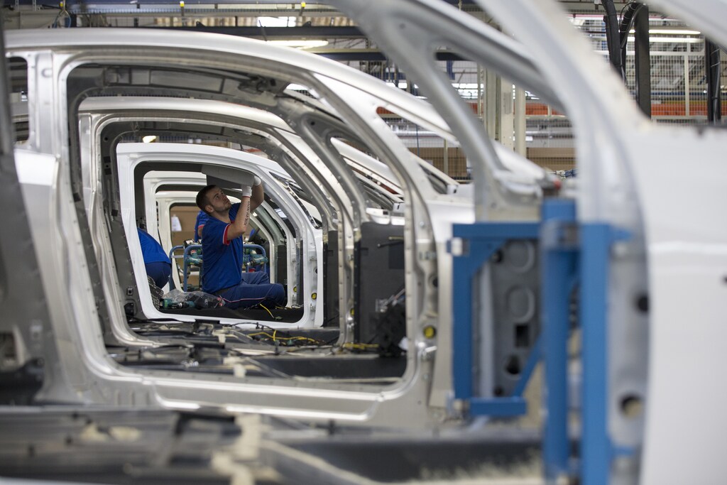 An employee works on the automobile assembly line of Bluecar electric city cars at a Renault car maker factory in Dieppe, western France, September 1, 2015. In June 2015, French carmaker Renault started the production of the Bollore Bluecar, stepping up its electric vehicle cooperation with French conglomerate Bollore. Picture taken September 1, 2015. REUTERS/Philippe Wojazer - PM1EB9215BB01