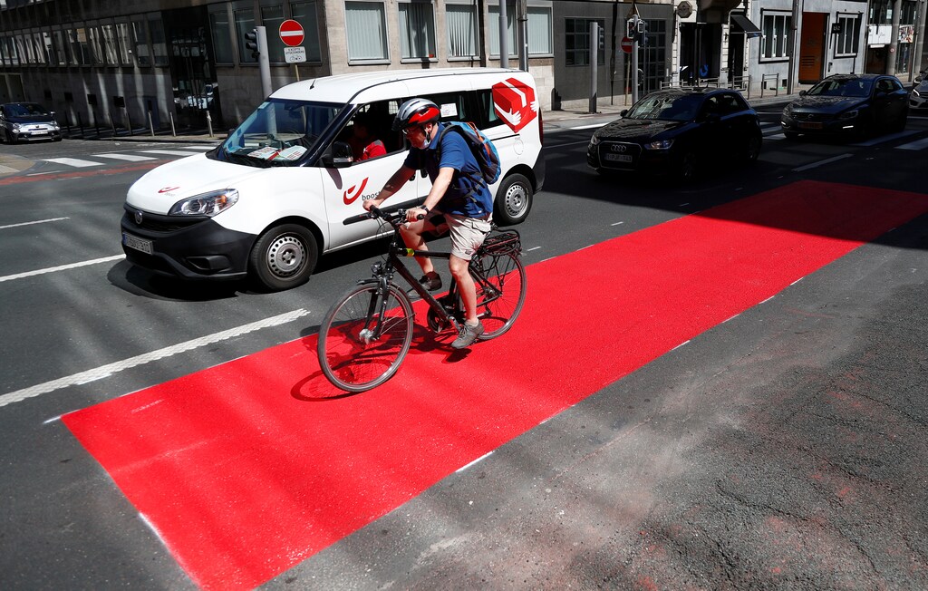 A man rides a bicycle on a new cycling lane in central Brussel, amid the coronavirus disease (COVID-19) outbreak in Brussels, Belgium.