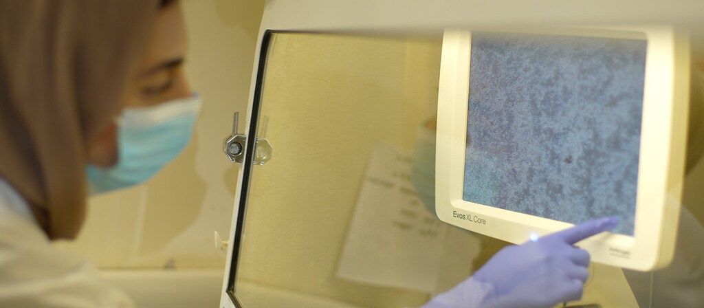 A scientist from Imperial College London analyzes COVID-19 cultures at St Mary's Hospital, London.