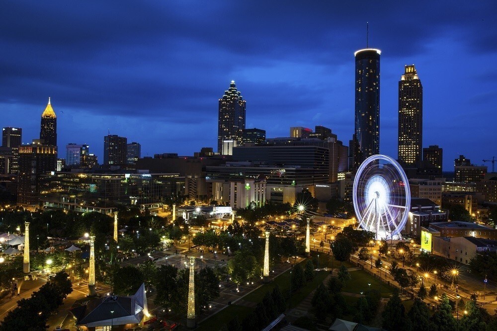 SkyView Atlanta, a 200-foot (61-meter) tall Ferris wheel with 42 gondolas, is seen on the South end of Centennial Park in downtown Atlanta, Georgia July 19, 2013. The Ferris wheel, which was previously located in Paris, Switzerland, and Pensacola, Florida, opened to the public in Atlanta on July 16. This the view from the 11th floor of the Omni Hotel at CNN Center. Picture taken on July 19, 2013. REUTERS/Chris Aluka Berry (UNITED STATES - Tags: ENTERTAINMENT CITYSPACE SOCIETY) - RTX11UC7