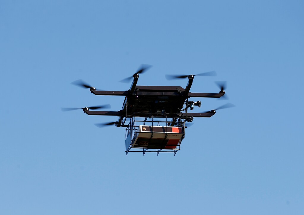 A drone demonstrates delivery capabilities from the top of a UPS truck during testing in Lithia, Florida, U.S. February 20, 2017. REUTERS/Scott Audette - RC19E3A71430