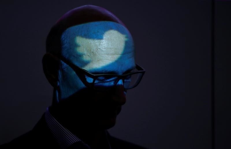 The logo of Twitter is projected to the head of Timotheus Hoettges, Chief Executive Officer of Germany's telecommunications giant Deutsche Telekom AG during the opening ceremony for the new Cyber Defense and Security Operation Center (SOC) of Telekom Security in Bonn October 26, 2017.