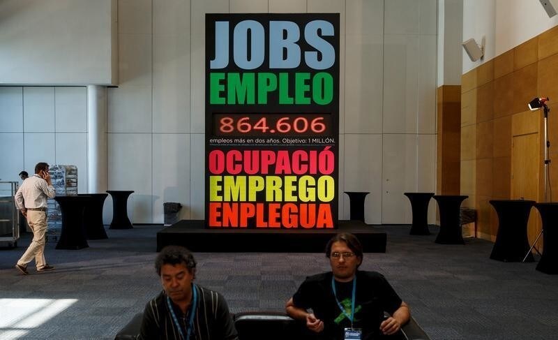 A huge board announces number of jobs created in the last two years at a political rally of the People's Party (PP) in Madrid, Spain, July 11, 2015. Spain said on Friday it would cut central government spending further in 2016, offsetting broad-based tax cuts unveiled last week as it looks to keep a healthy economic recovery on track ahead of national elections. Sign reads "The future of Spain". REUTERS/Andrea Comas - GF10000156131