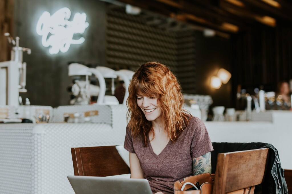 A person sitting at her laptop.