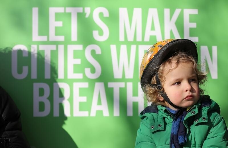 Raul Mullan, age three, attends at an event organised by the Green Party, to highlight their demand for air pollution action from the government, in Brixton, London, Britain February 24, 2018.