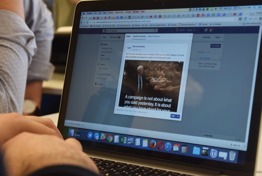 Hector Sigala (lower left, hands), digital media director for the Bernie Sanders election campaign, works on the campaign's social media accounts at the digital team's office in Washington D.C., March 17, 2016.