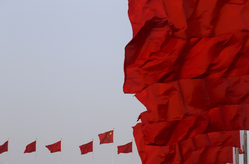 Chinese national flags flutter at Tiananmen Square ahead of the opening session of the National People's Congress (NPC) in Beijing, China, March 5, 2016. REUTERS/Kim Kyung-hoon/File Photo - RTX2B45C