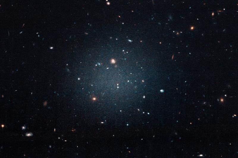 The galaxy named NGC 1052-DF2, a large fuzzy-looking galaxy so diffused that astronomers call it a 'see-through' galaxy because its missing most, if not all of its dark matter, is shown in this photo obtained from NASA on March 28, 2018. NASA, ESA, and P. van Dokkum (Yale University)/Handout via REUTERS ATTENTION EDITORS - THIS IMAGE WAS PROVIDED BY A THIRD PARTY - RC1277298730