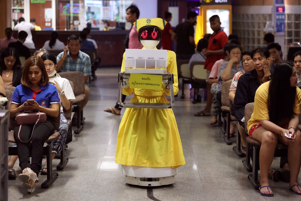A robot wearing a nurse costume carries medical documents at Mongkutwattana General Hospital in Bangkok, Thailand, February 6, 2019. REUTERS/Athit Perawongmetha - RC1EA4F20BC0