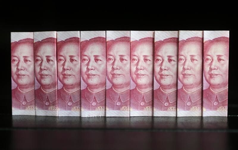 Chinese 100 yuan banknotes are seen in this picture illustration taken in Beijing July 11, 2013. China's central bank has standardised rules on cross-border yuan transactions for domestic banks and companies, the latest step to boost the yuan's global influence. REUTERS/Jason Lee (CHINA - Tags: BUSINESS TPX IMAGES OF THE DAY) - RTX11JFZ