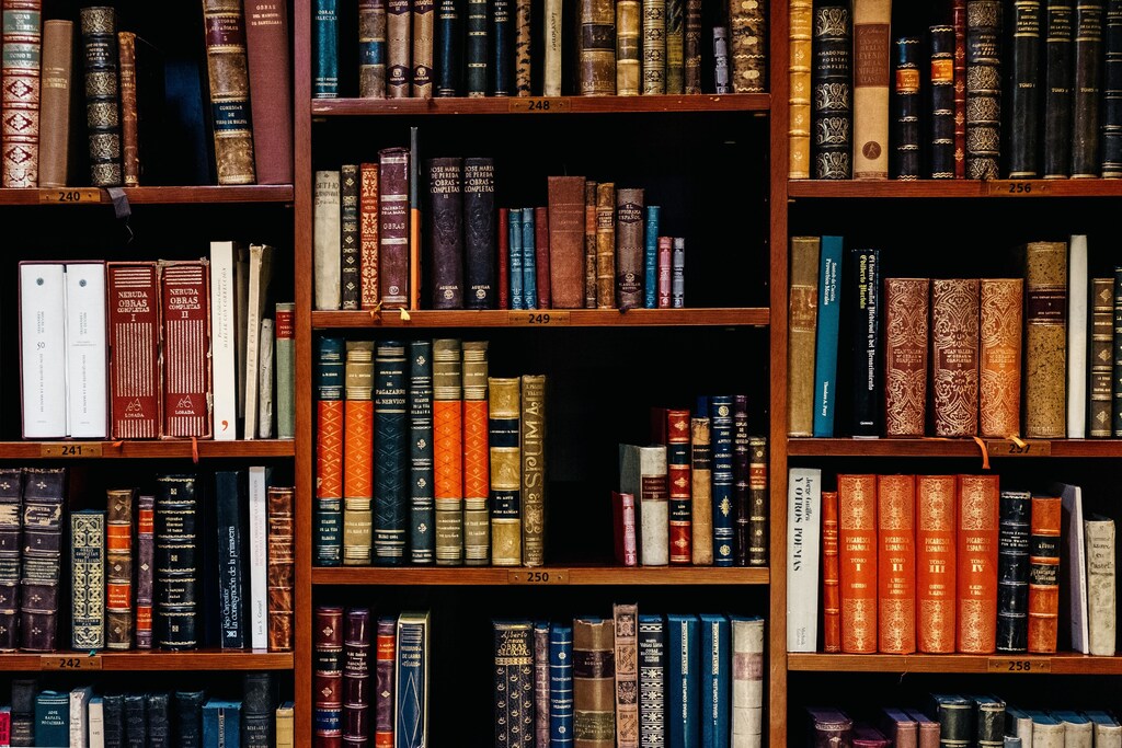 Educational books in library shelves