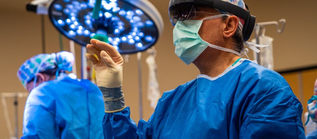 image of orthopedic surgeon Dr. John Sledge using HoloLens 2 headset during a spinal fusion surgery
