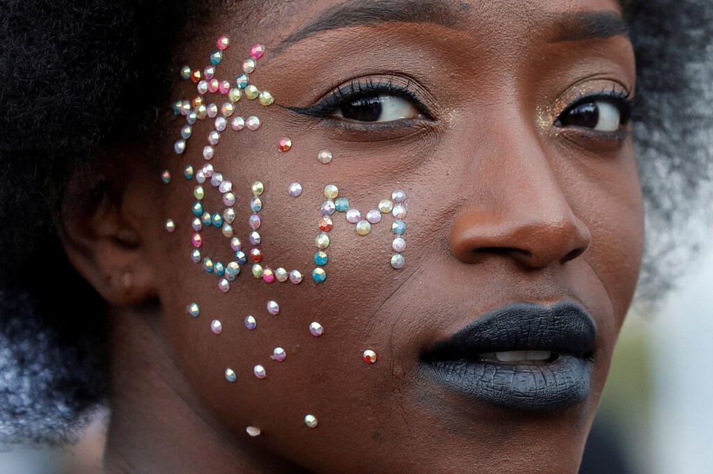 A woman attends a banned demonstration planned in memory of Adama Traore, a 24-year-old black Frenchman who died in a 2016 police operation which some have linked to the death of George Floyd in the United States, in front of courthouse in Paris, France June 2, 2020. REUTERS/Gonzalo Fuentes TPX IMAGES OF THE DAY - RC241H9UW2SR