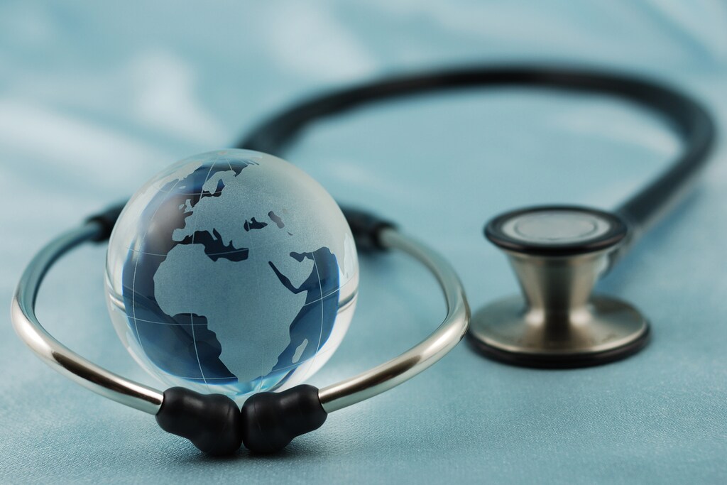 A globe in the middle of a stethoscope: Standards are essential tools for climate-resilient healthcare